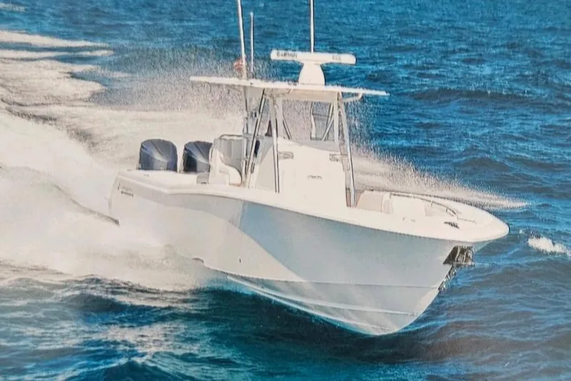 Slide: The Image of 2017 Invincible 33 Open Fisherman boat cruising on open ocean waters. - 12
