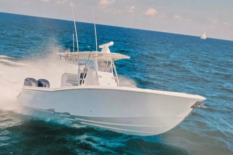 Slide: The Image of 2017 Invincible 33 Open Fisherman speeding on ocean waters. - 2