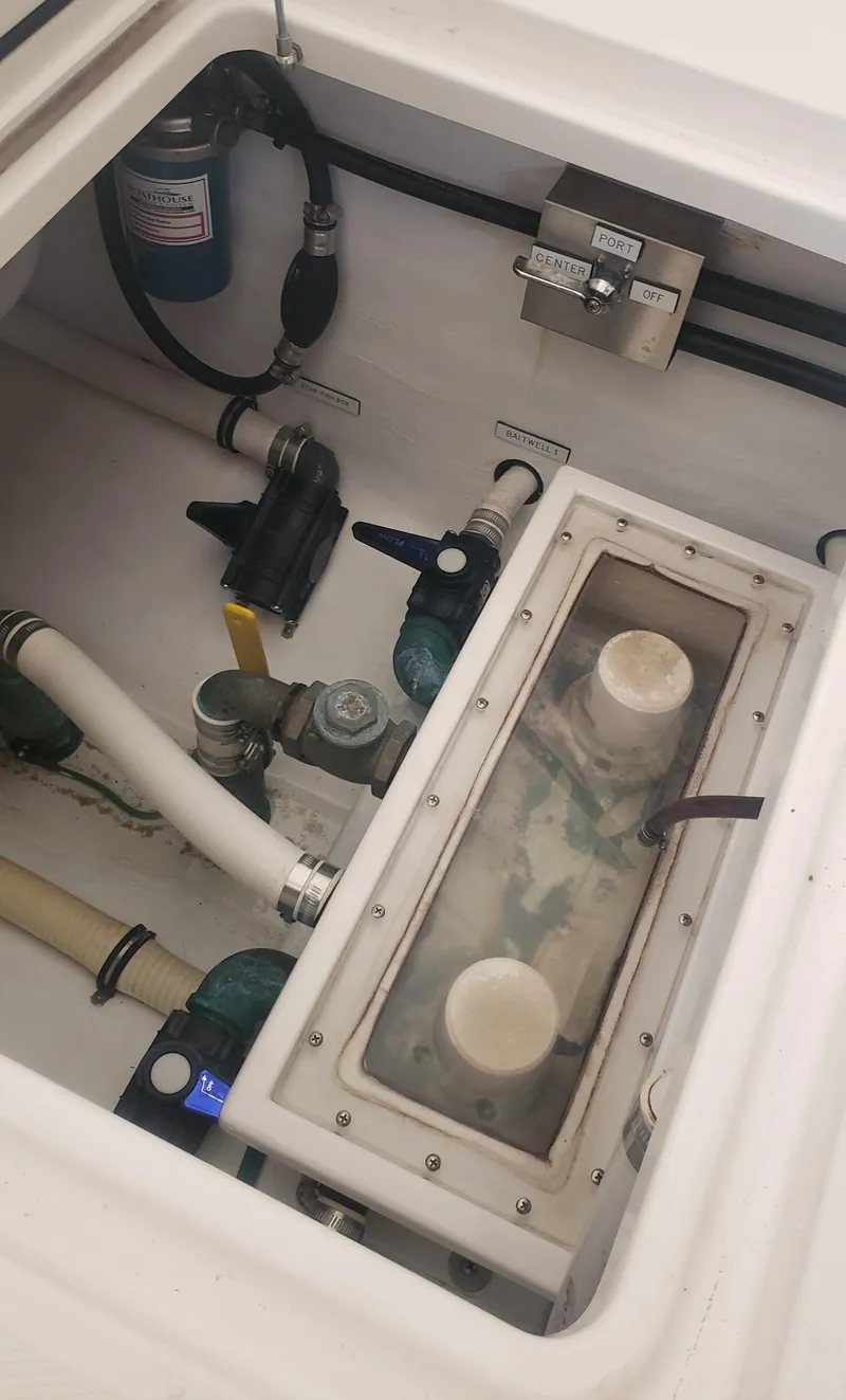 Slide: The Image of 2017 Invincible 33 Open Fisherman boat compartment with pumps and wiring. - 20