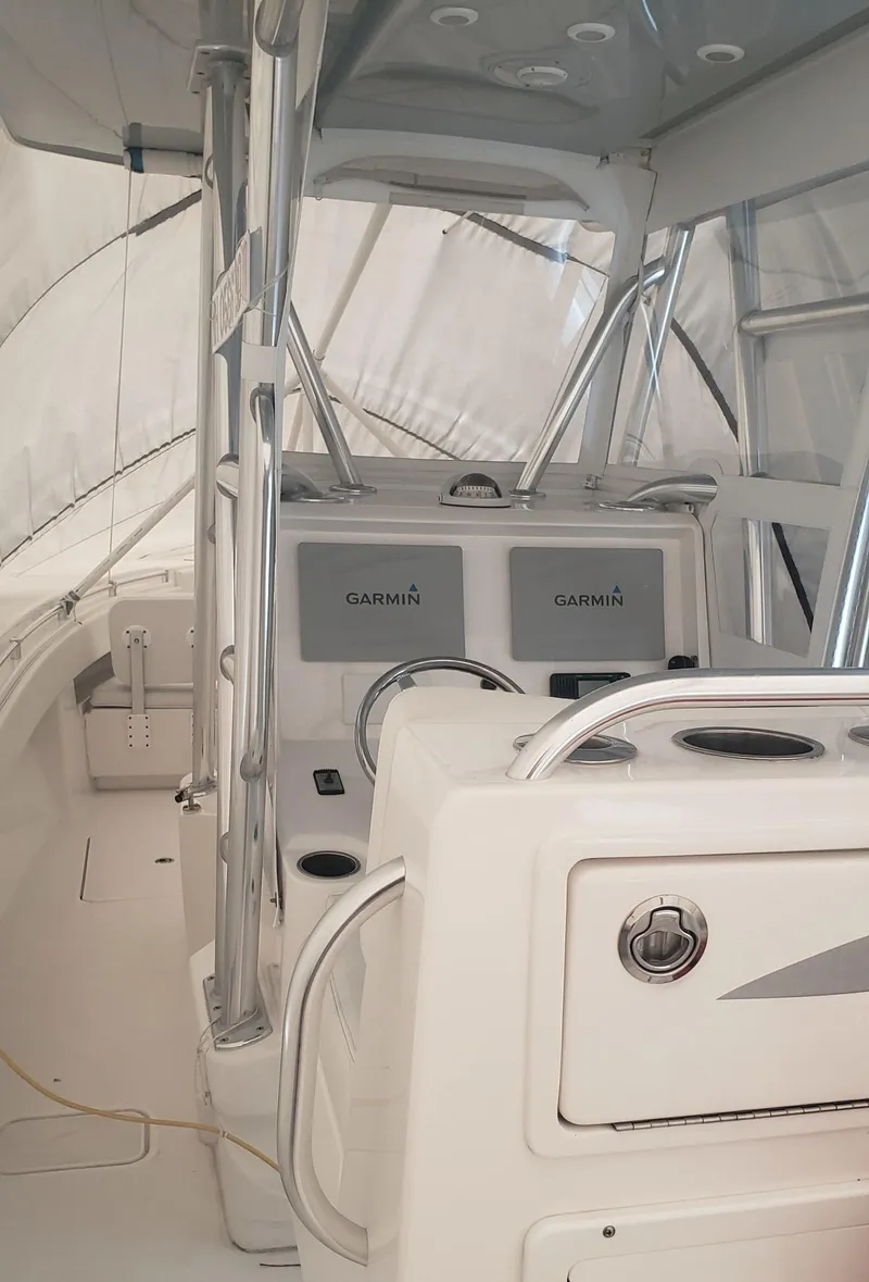 Slide: The Image of 2017 Invincible 33 Open Fisherman boat interior with Garmin navigation systems. - 24