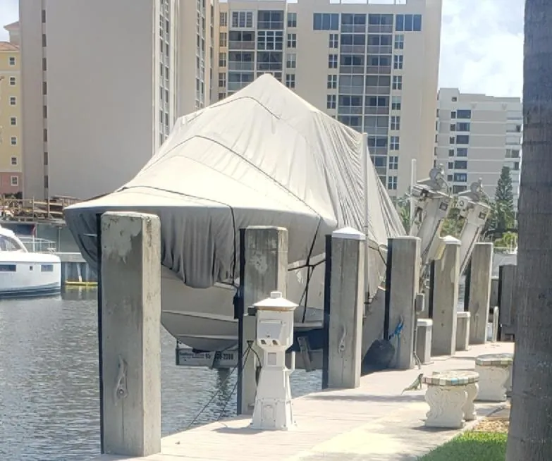 Slide: The Image of Covered 2017 Invincible 33 Open Fisherman boat docked near waterfront buildings. - 28