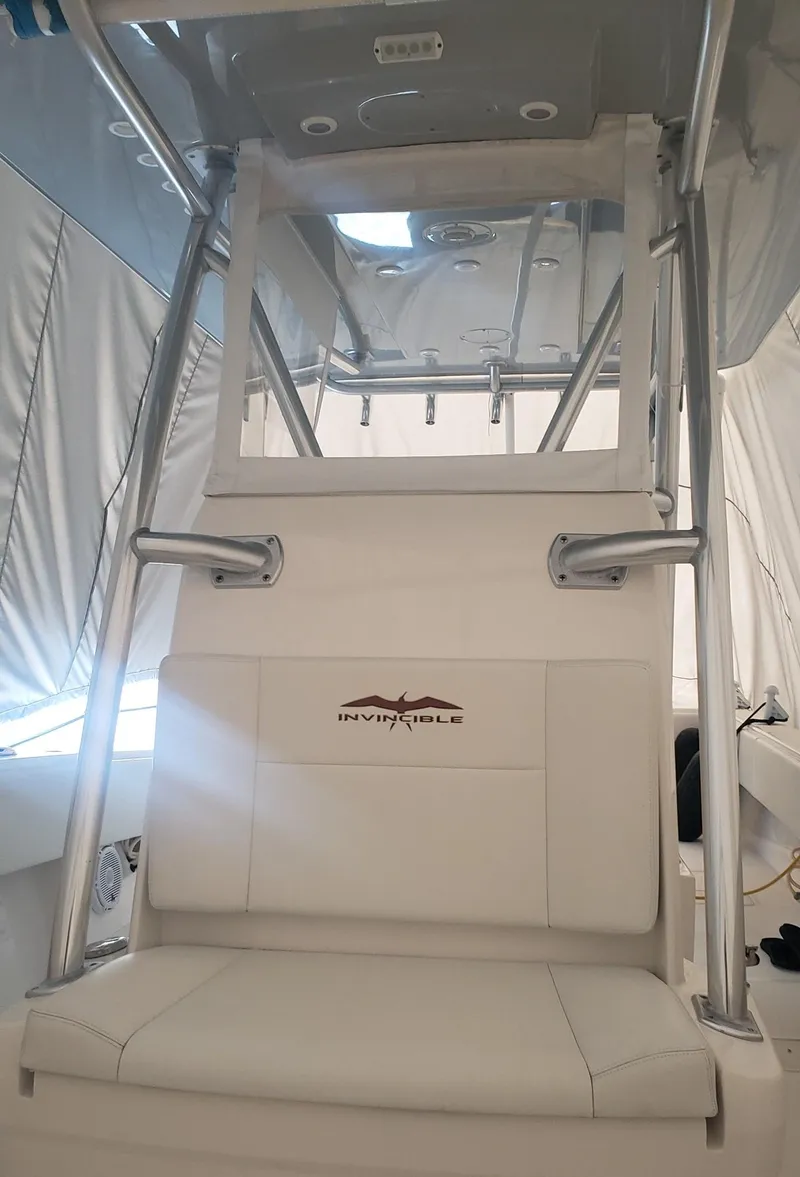 Slide: The Image of 2017 Invincible 33 Open Fisherman boat interior with seating and console. - 29