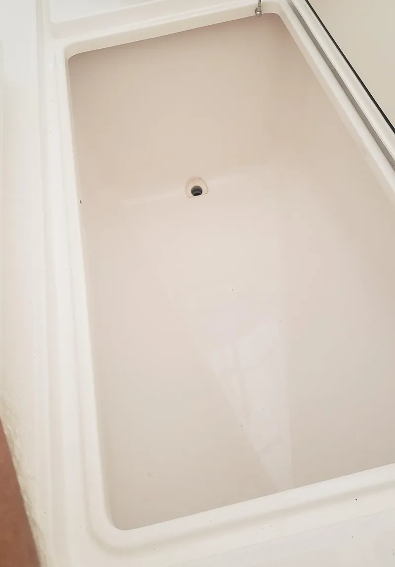 Slide: The Image of 2017 Invincible 33 Open Fisherman boat storage compartment, clean and spacious design. - 30