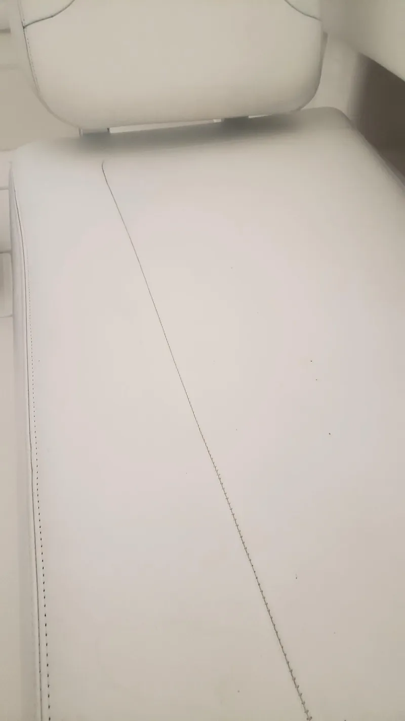 Slide: The Image of White leather seating on 2017 Invincible 33 Open Fisherman boat. - 34