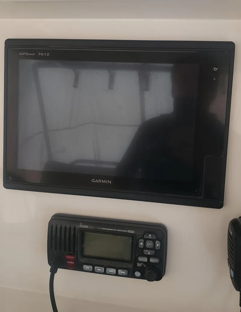 Slide: The Image of Garmin GPS and radio equipment on 2017 Invincible 33 Open Fisherman boat. - 35