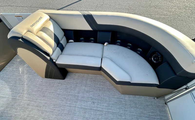 Slide: The Image of 2024 Berkshire 22CL2 CTS boat seating with beige and black upholstery. - 11