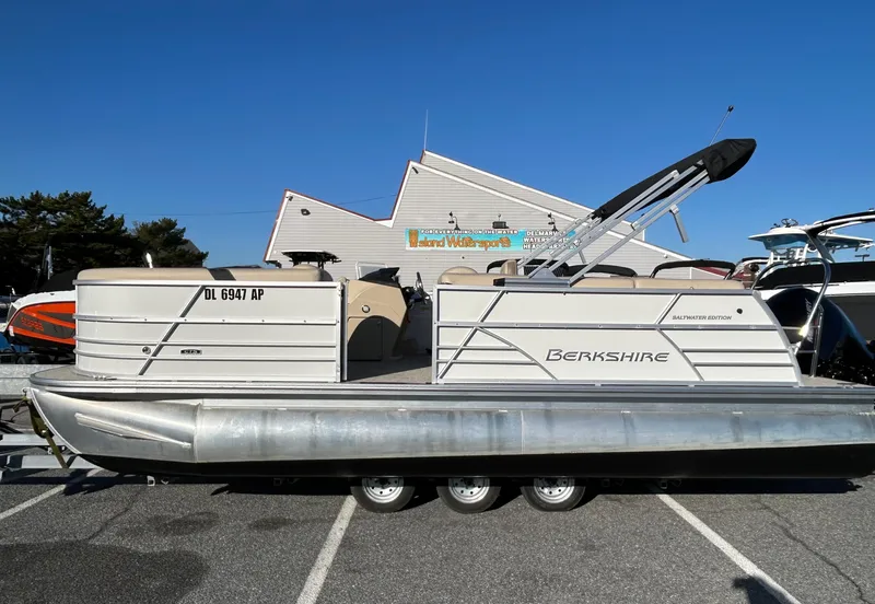 Slide: The Image of 2024 Berkshire 22CL2 CTS pontoon boat parked on a sunny day. - 3