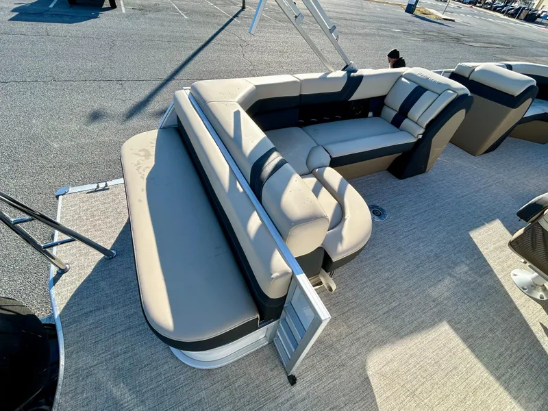 Slide: The Image of 2024 Berkshire 22CL2 CTS pontoon boat with beige and black seating arrangement. - 6