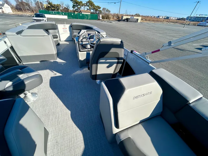 Slide: The Image of 2024 Berkshire 23RFX STS 3.0 pontoon boat interior with modern seating and steering console. - 10