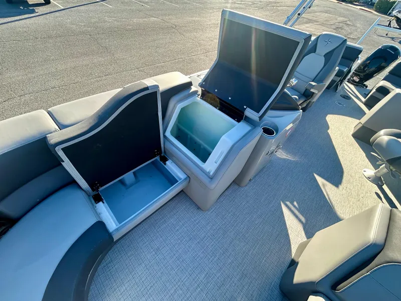 Slide: The Image of 2024 Berkshire 23RFX STS 3.0 boat interior with open storage compartments. - 19