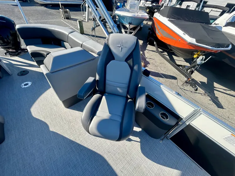 Slide: The Image of 2024 Berkshire 23RFX STS 3.0 boat interior with luxury seating and cup holders. - 21