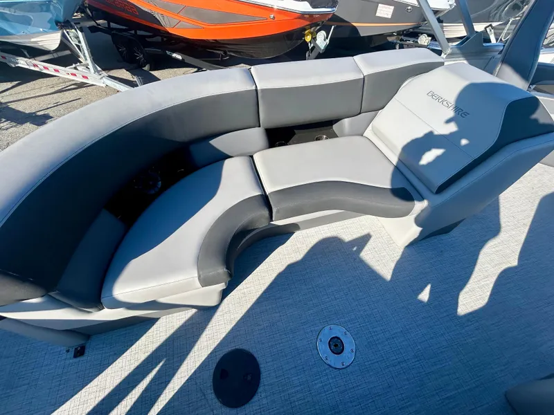 Slide: The Image of 2024 Berkshire 23RFX STS 3.0 boat interior with gray seating and carpeted floor. - 6