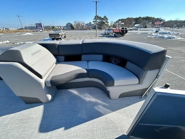 Slide: The Image of 2024 Berkshire 23RFX STS 2.75 pontoon boat with spacious seating in a sunny parking lot. - 12