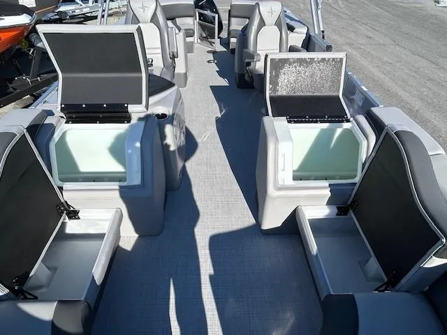 Slide: The Image of 2024 Berkshire 23RFX STS 2.75 boat interior with open storage compartments. - 13