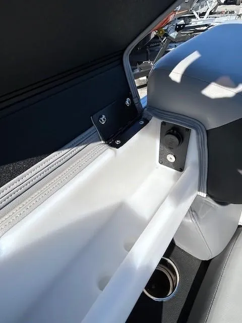 Slide: The Image of 2024 Berkshire 23RFX STS 2.75 boat interior with sleek seating and storage compartment. - 14