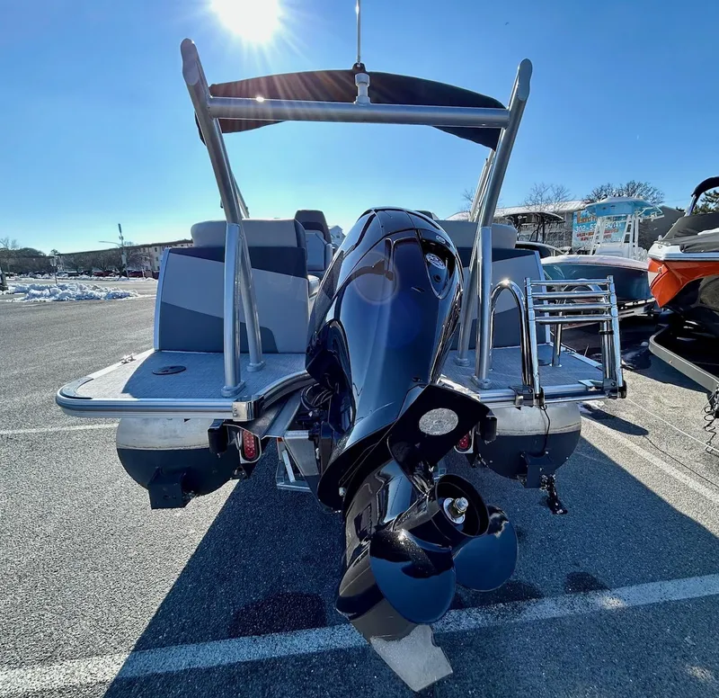 Slide: The Image of 2024 Berkshire 23RFX STS 2.75 pontoon boat, rear view with outboard motor. - 18