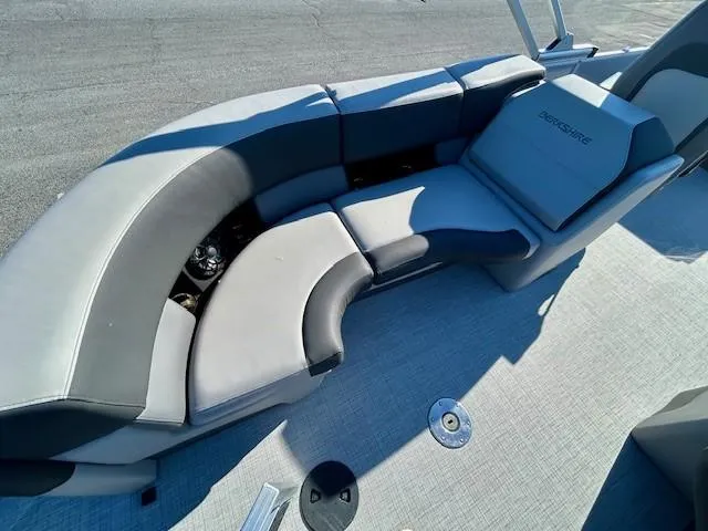 Slide: The Image of 2024 Berkshire 23RFX STS 2.75 boat interior with gray seating and flooring. - 8