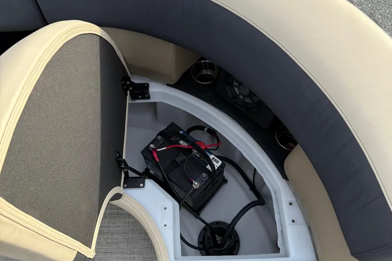 Slide: The Image of 2024 Berkshire 23RFX STS boat battery compartment with seating and wiring. - 25
