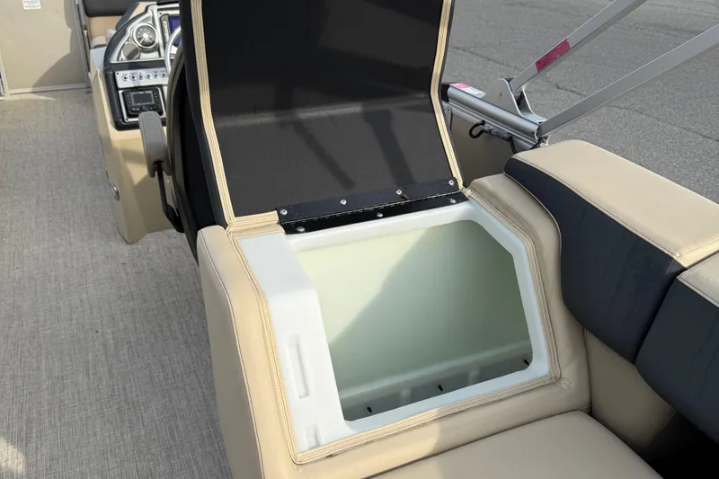 Slide: The Image of 2024 Berkshire 23RFX STS boat interior with open storage compartment. - 26