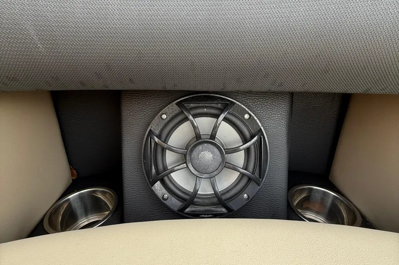 Slide: The Image of 2024 Berkshire 23RFX STS speaker system with cup holders in beige and black interior. - 27