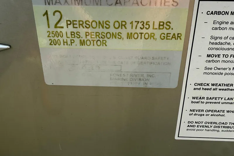 Slide: The Image of 2024 Berkshire 23RFX STS capacity label: 12 persons, 1735 lbs, 200 HP motor. - 28