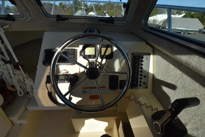 Slide: The Image of Steering wheel and dashboard of 2013 Parker 2320 SL Sport Cabin boat. - 20