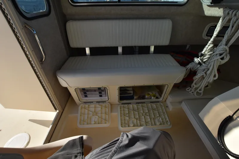 Slide: The Image of Interior of 2013 Parker 2320 SL Sport Cabin with storage compartments and seating. - 25