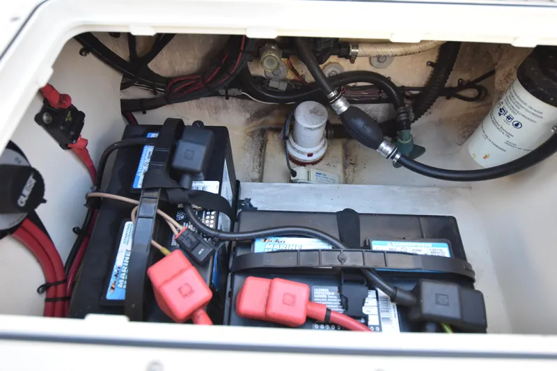 Slide: The Image of Battery compartment of 2013 Parker 2320 SL Sport Cabin boat, showing wiring and components. - 27