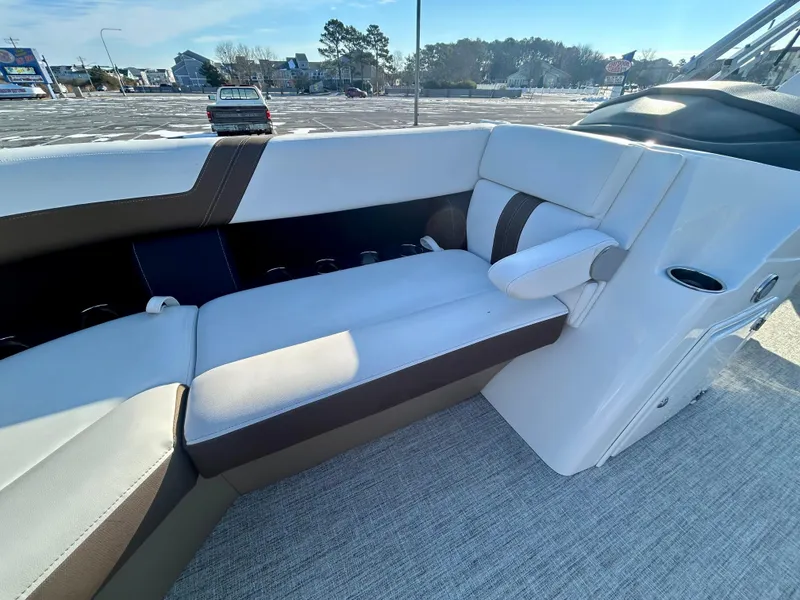 Slide: The Image of 2024 Berkshire 24RFC CTS 2.75 boat interior with cushioned seating and modern design. - 11