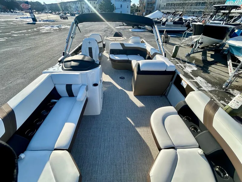 Slide: The Image of 2024 Berkshire 24RFC CTS 2.75 pontoon boat interior with spacious seating and modern design. - 12