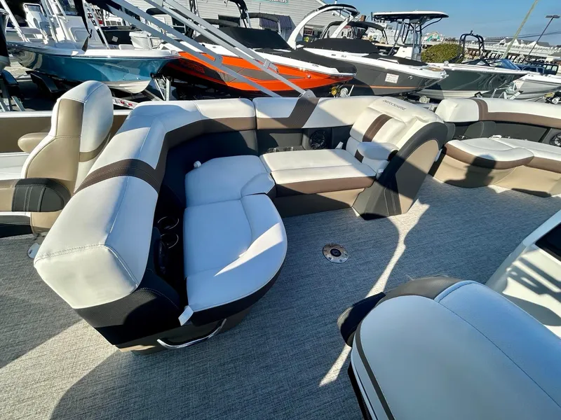 Slide: The Image of 2024 Berkshire 24RFC CTS 2.75 pontoon boat interior with plush seating. - 14