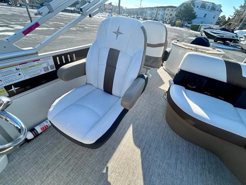 Slide: The Image of 2024 Berkshire 24RFC CTS 2.75 boat interior with plush seating and modern design. - 16