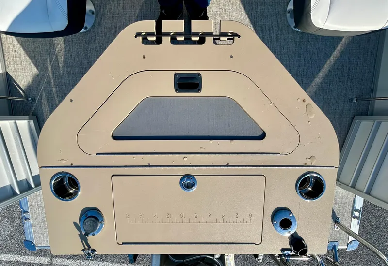 Slide: The Image of 2024 Berkshire 24RFC CTS 2.75 boat console with controls and cup holders. - 17