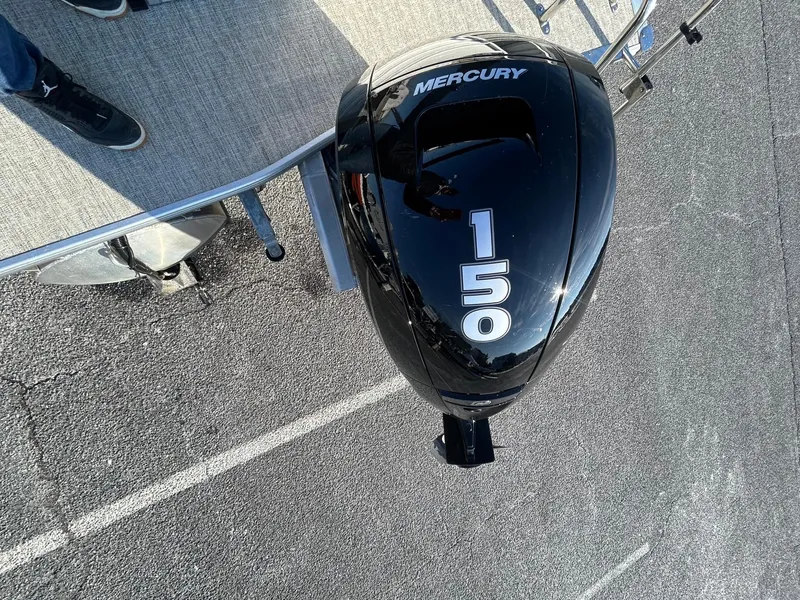 Slide: The Image of 2024 Berkshire 24RFC CTS 2.75 with Mercury 150 outboard motor on a boat deck. - 18