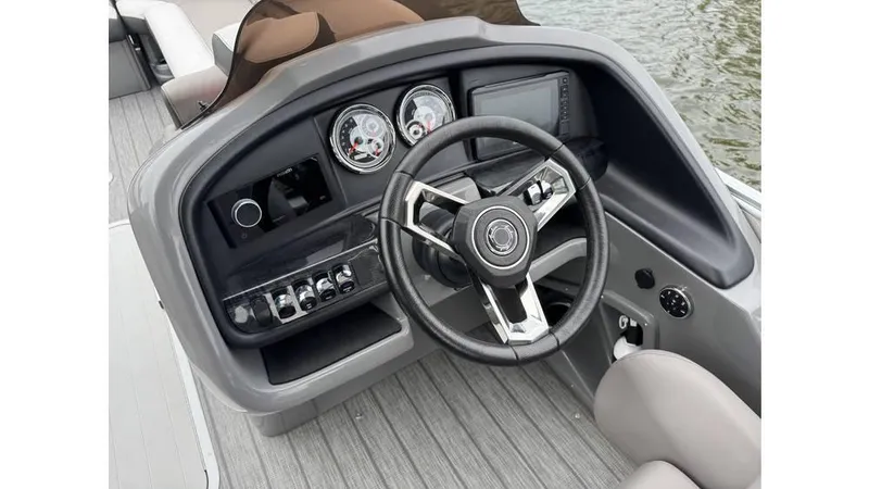 Slide: The Image of 2023 Avalon 2585 VRB boat dashboard with steering wheel and control panel. - 10