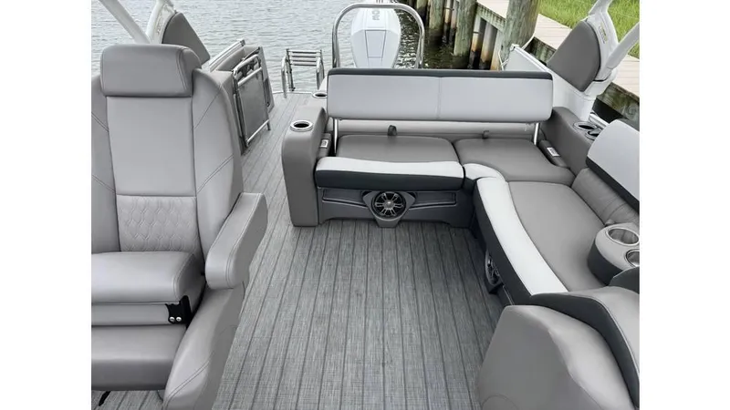 Slide: The Image of 2023 Avalon 2585 VRB boat interior with gray seating and modern design. - 16