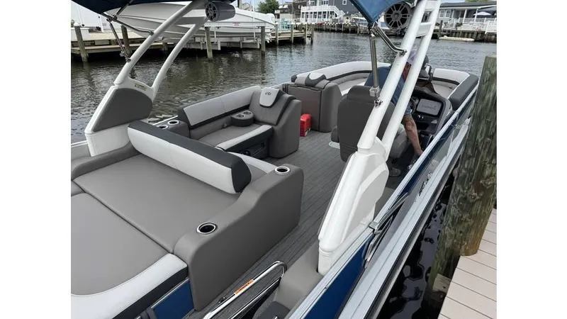 Slide: The Image of 2023 Avalon 2585 VRB pontoon boat with spacious seating and modern design docked by the water. - 4