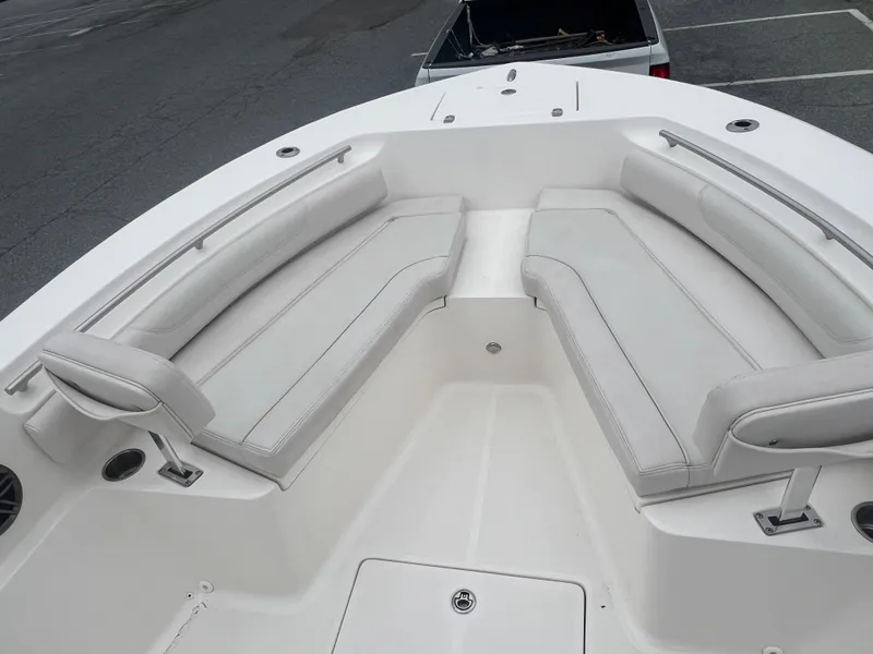 Slide: The Image of 2024 Sea Born LX24 LE boat with spacious seating area and sleek design. - 11