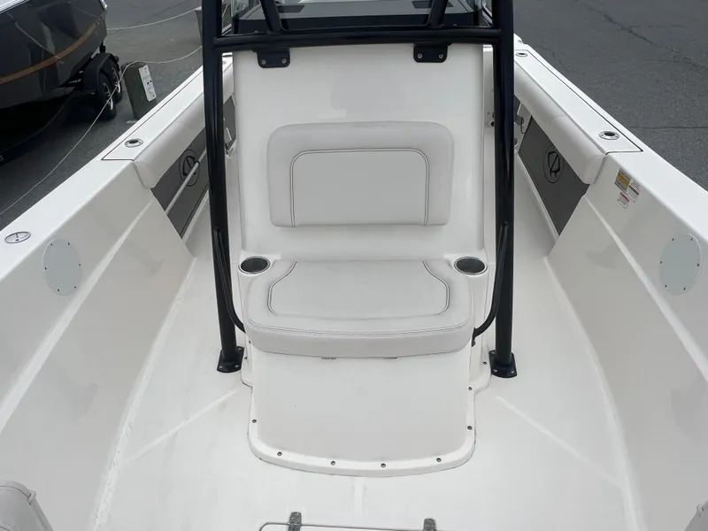 Slide: The Image of 2024 Sea Born LX24 LE boat interior with white seating and cup holders. - 12