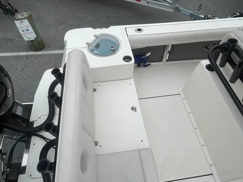 Slide: The Image of 2024 Sea Born LX24 LE boat interior with seating and storage compartments. - 4