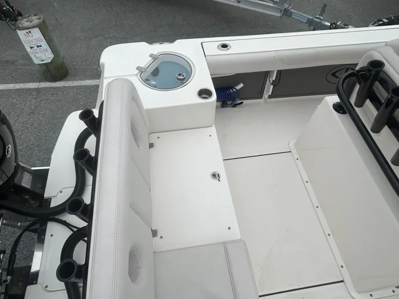 Slide: The Image of 2024 Sea Born LX24 LE boat interior with seating and storage compartments. - 5