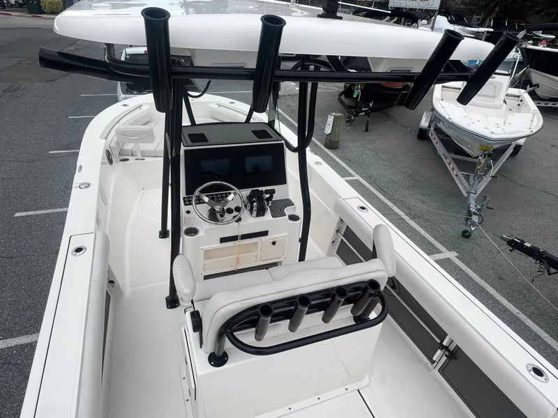 Slide: The Image of 2024 Sea Born LX24 LE boat with sleek console and rod holders. - 7