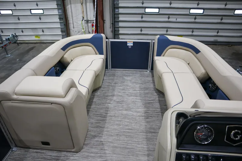 Slide: The Image of 2025 Godfrey Sweetwater 2086 C pontoon boat interior with beige and blue seating. - 10