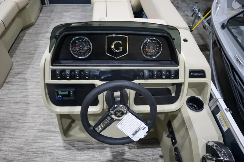 Slide: The Image of 2025 Godfrey Sweetwater 2086 C boat dashboard with steering wheel and control panel. - 9
