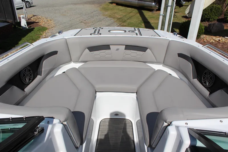 Slide: The Image of 2025 Four Winns HD3 boat interior with gray seating and modern design. - 10