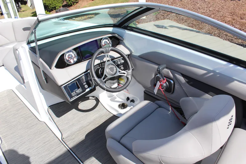 Slide: The Image of 2025 Four Winns HD3 boat interior with modern dashboard and steering wheel. - 11