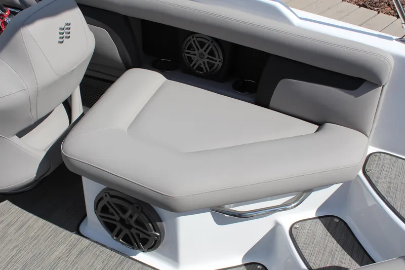 Slide: The Image of 2025 Four Winns HD3 boat interior with gray seating and built-in speakers. - 13