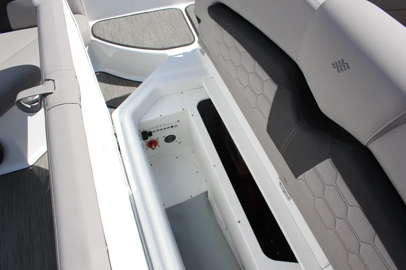 Slide: The Image of 2025 Four Winns HD3 boat interior storage compartment with cushioned seating. - 14