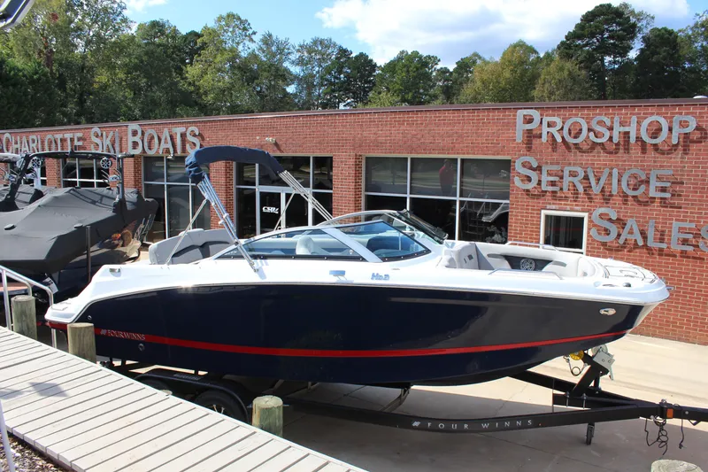 Slide: The Image of 2025 Four Winns HD3 boat displayed at Charlotte Ski Boats dealership. - 4