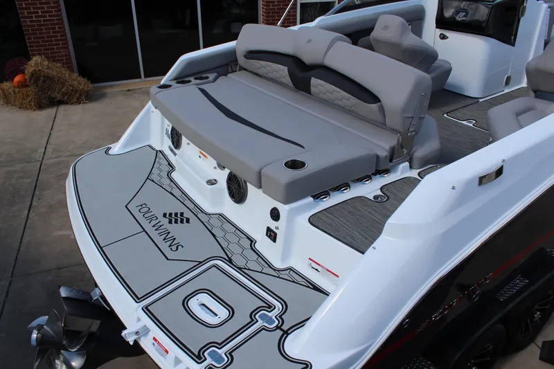 Slide: The Image of 2025 Four Winns HD3 boat with spacious seating and modern design. - 5